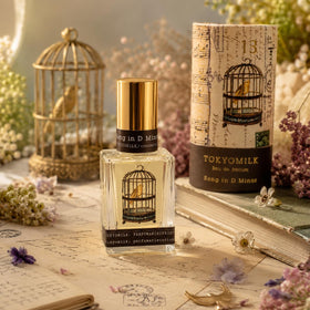 TOKYOMILK Song in D Minor Eau de Parfum displaying bird in cage design