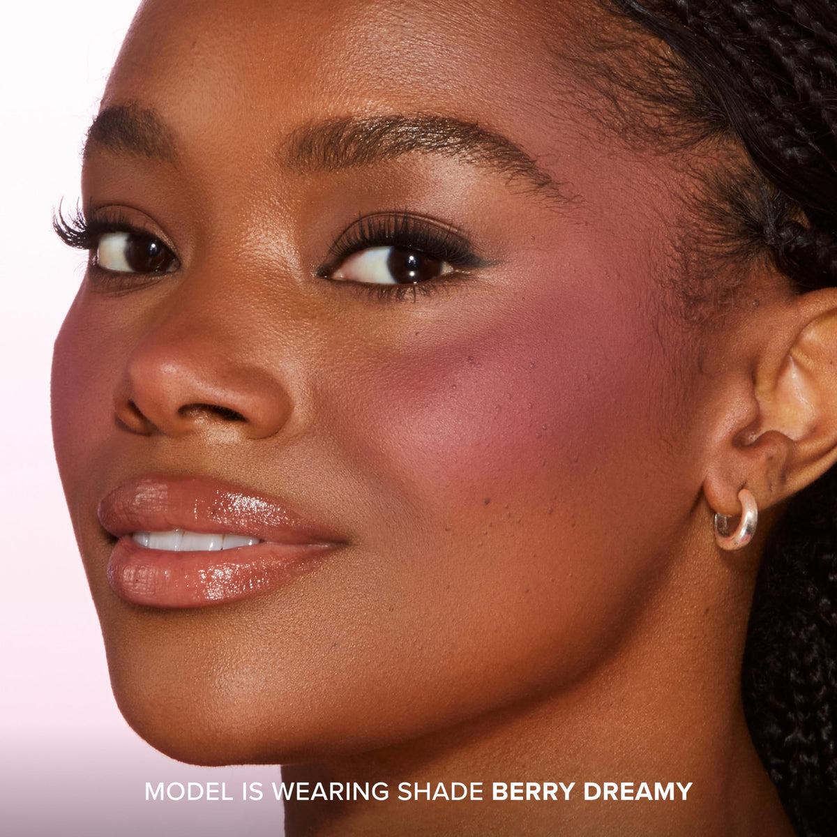 Too Faced Cloud Crush Blurring Blush Berry Dreamy on model's cheeks