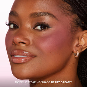 Too Faced Cloud Crush Blurring Blush Berry Dreamy on model's cheeks
