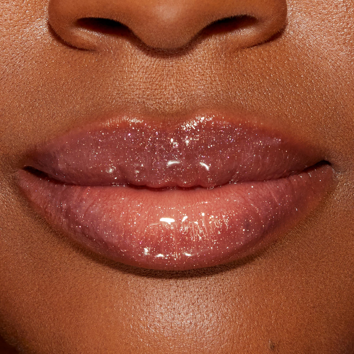 Too Faced Lip Injection Lip Gloss lifestyle scene with makeup