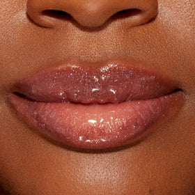 Too Faced Lip Injection Lip Gloss lifestyle scene with makeup