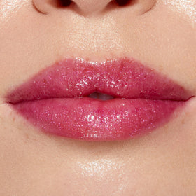 Too Faced Lip Injection Lip Gloss with strawberries background