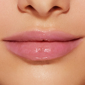 Too Faced Lip Injection Lip Gloss with strawberries background