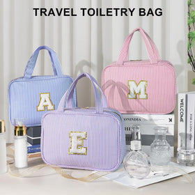 TOPEAST Hanging Travel Bag packaging with initial G displayed