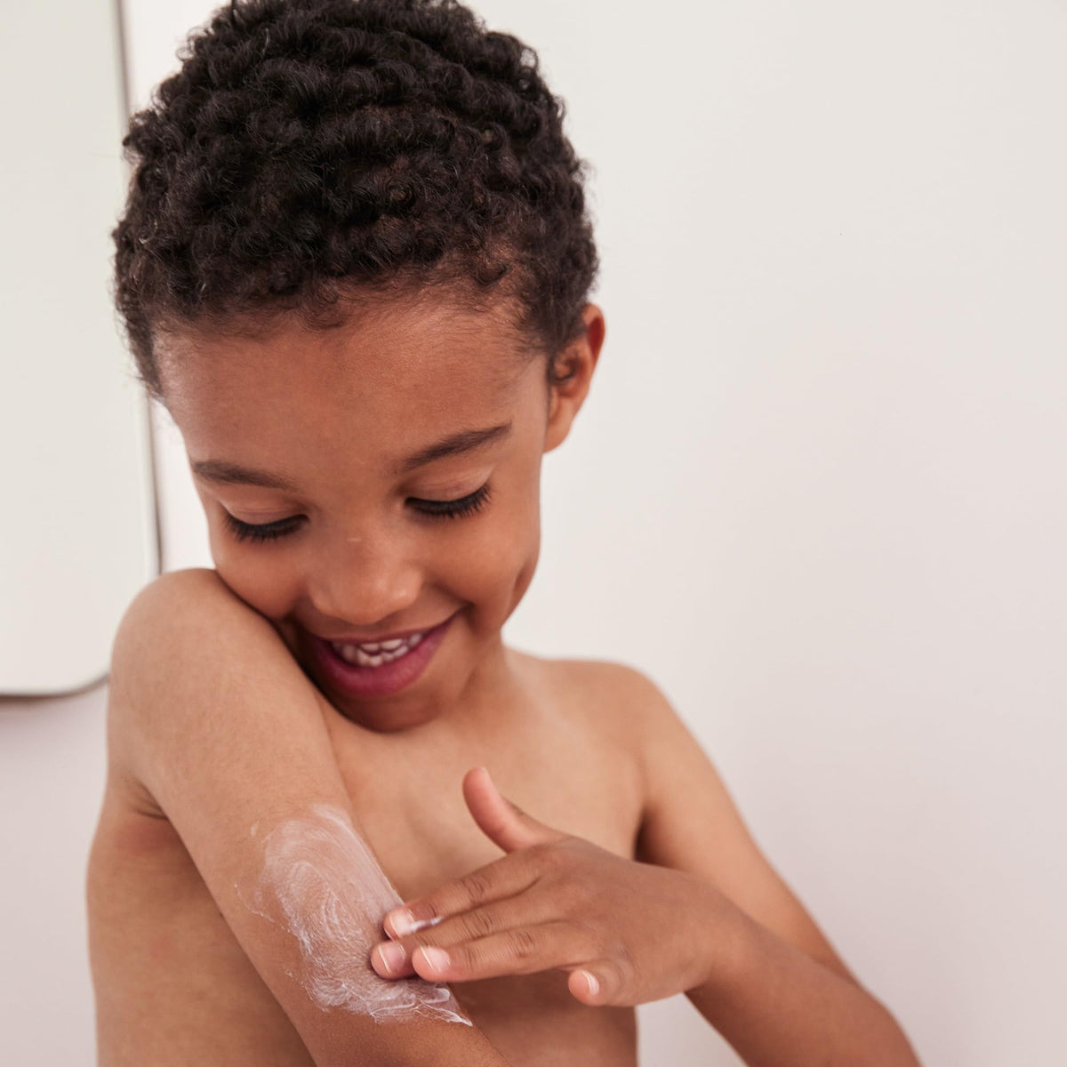 Topicrem Atopic Skin AD Emollient Balm applied on skin