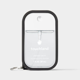 Touchland Hand Mist Case in lifestyle setting on a table
