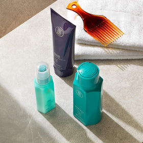 TPH by Taraji Co-Wash 12oz next to other hair care products