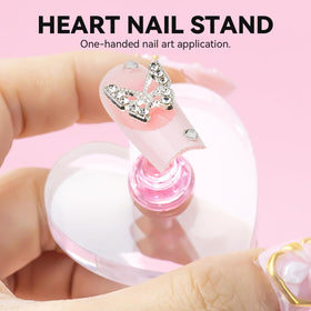 Transparent heart-shaped acrylic nail stand from ESUOHYM