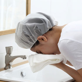 Travel-friendly Pengxiaomei shower cap folded in bag