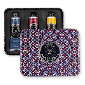 Travel size hand cream set displayed with a towel