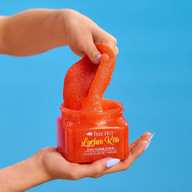 Tree Hut Lychee Kiss Body Scrub 18 Oz in a bathroom setting