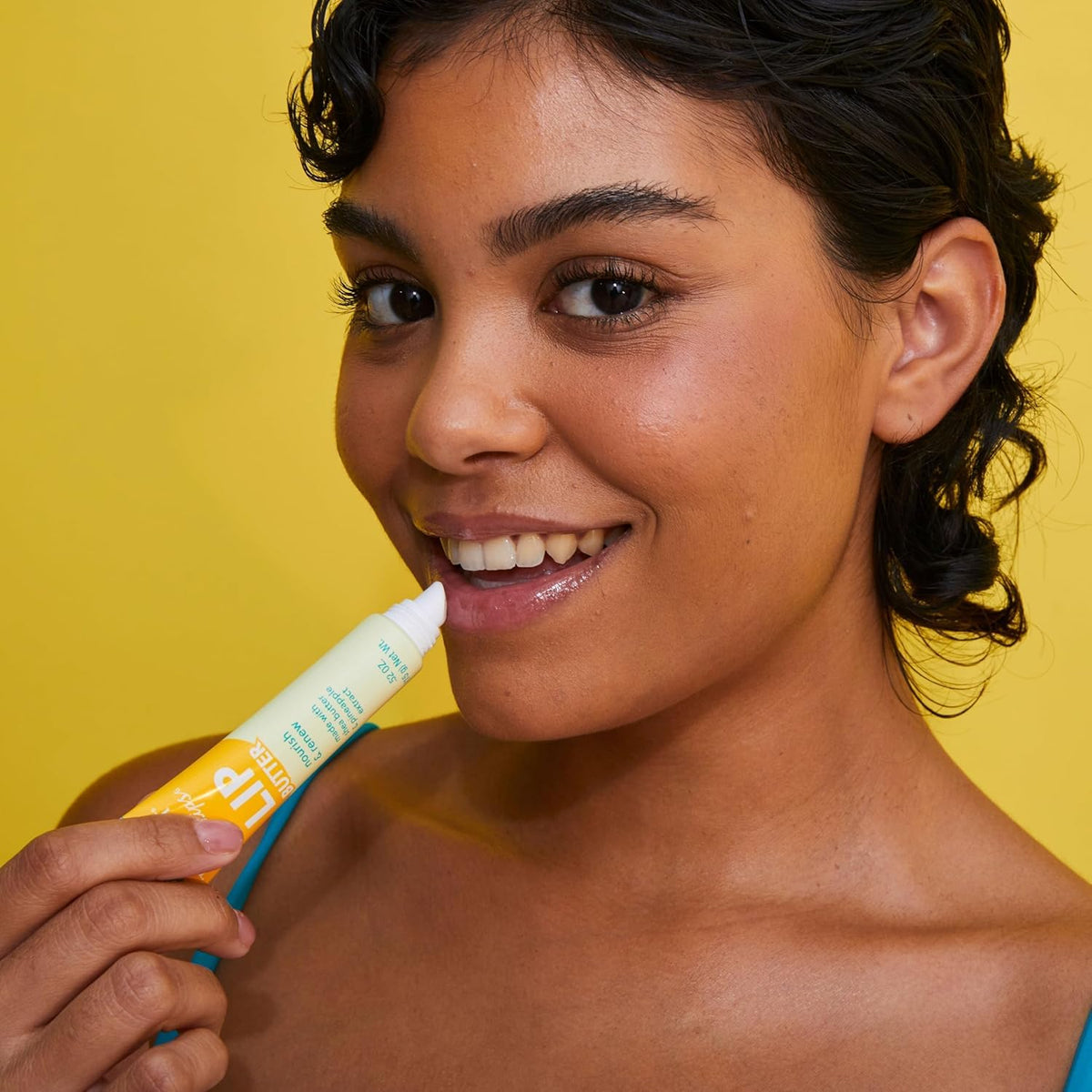 Tree Hut Pineapple Lip Butter on a wooden surface