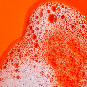 Tree Hut Tangerine Serum Infused Hand Wash with a towel