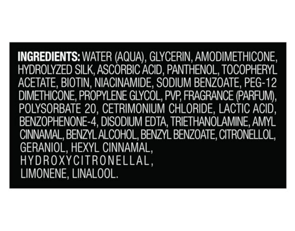 TRESemmé Heat Tamer Spray being applied to hair