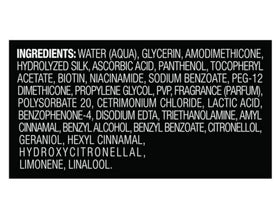 TRESemmé Heat Tamer Spray being applied to hair