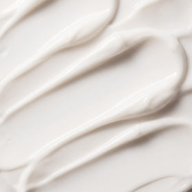 Trilogy Vital Moisturizing Cream on a wooden surface
