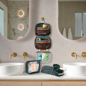 TRIPPED Toiletry Bag Kit Set hanging in a bathroom