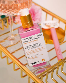 Truly Unicorn Fruit After Shave Serum with ingredients list on display