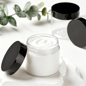 TUZAZO containers filled with lotions and creams