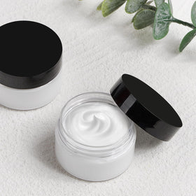 TUZAZO jars in a travel kit setting