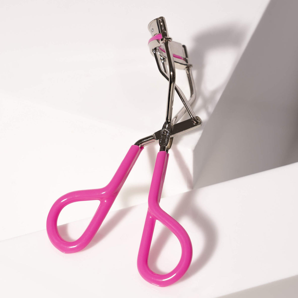 Tweezerman Comfort Grip Eyelash Curler Neon Pink side view