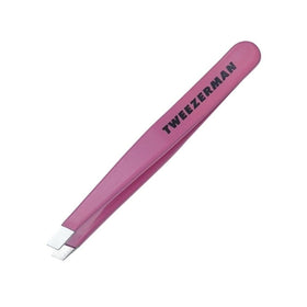 Tweezerman Mini Slant Tweezer Neon Pink on a vanity