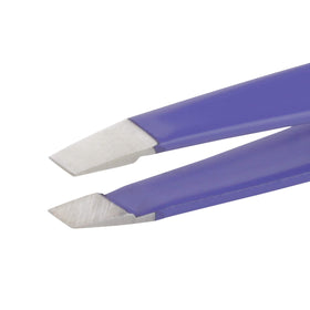 Tweezerman Mini Slant Tweezer on a vanity table