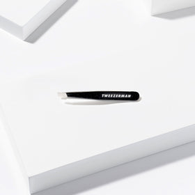 Tweezerman Mini Slant Tweezer with warm washcloth