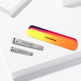 Tweezerman nail clippers and files in vibrant neon packaging