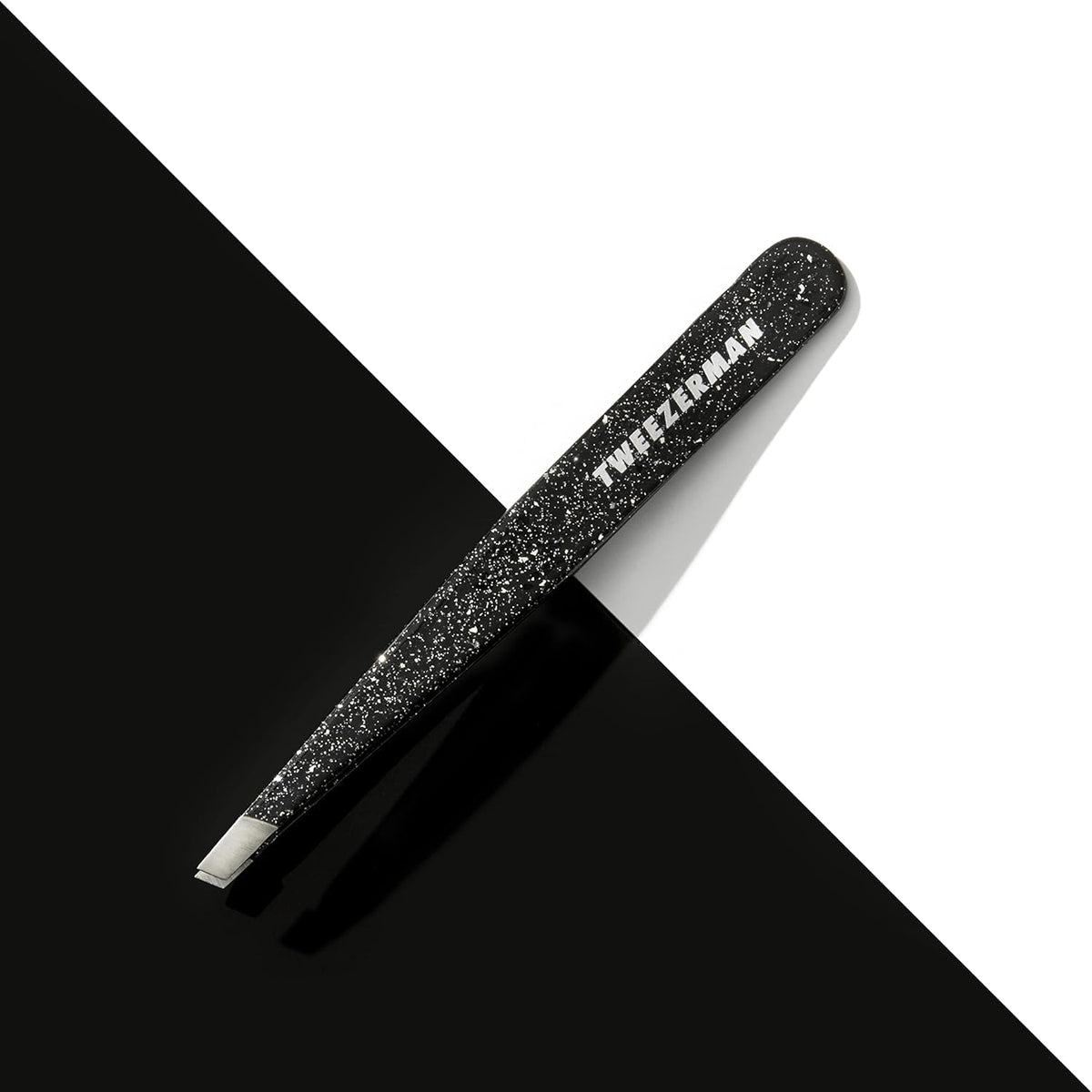 Tweezerman Slant Tweezer Dusted Onyx in use on eyebrows