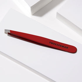 Tweezerman Slant Tweezer in hand demonstrating use