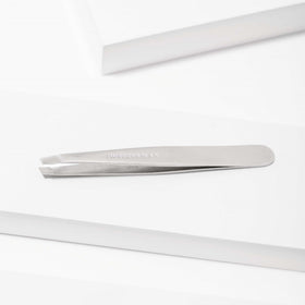 Tweezerman Slant Tweezer in use on eyebrows