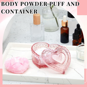 Two heart-shaped powder puffs in pink