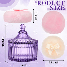 Two soft powder puffs on a white background