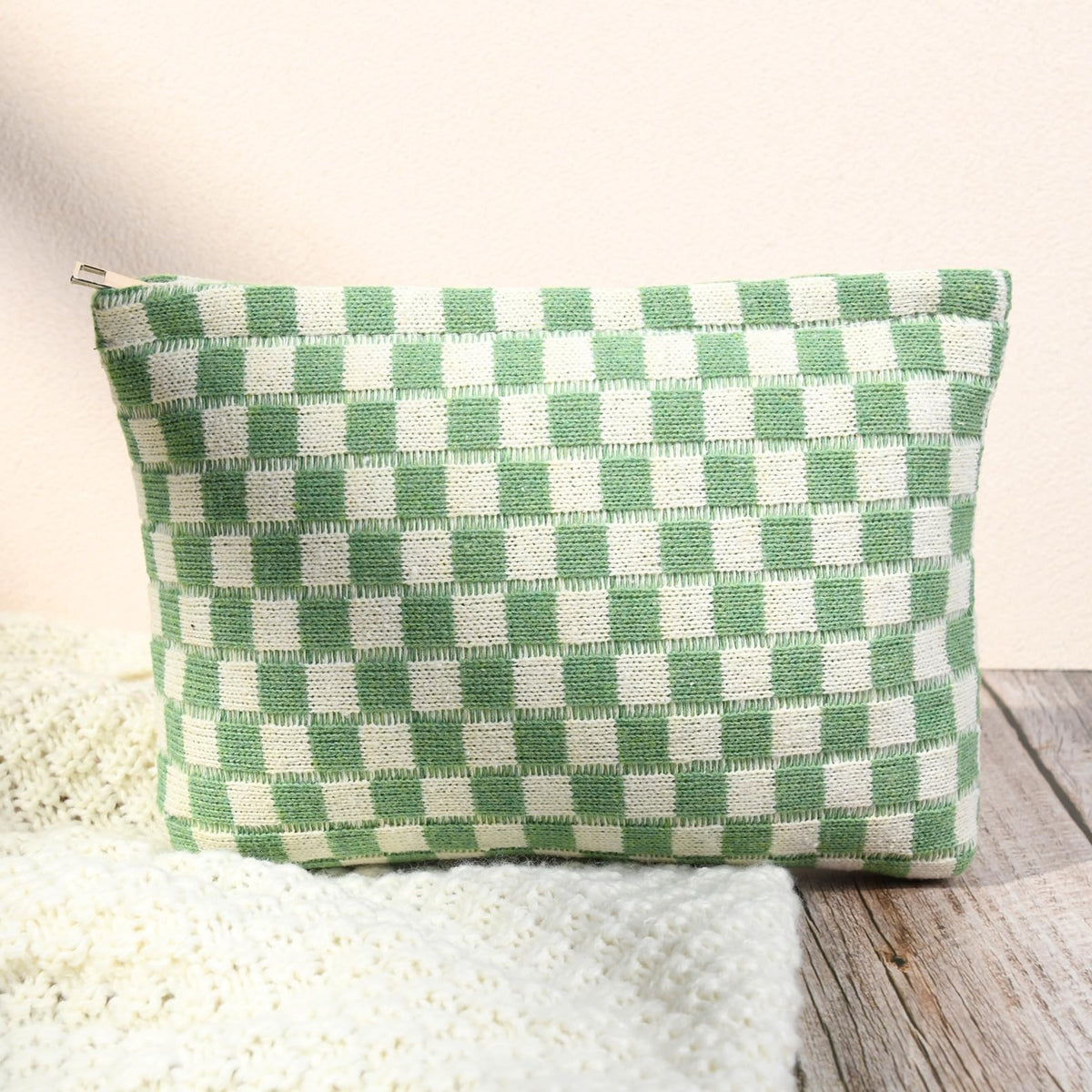Two SOIDRAM makeup bags displayed together in green checkered pattern