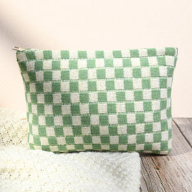 Two SOIDRAM makeup bags displayed together in green checkered pattern