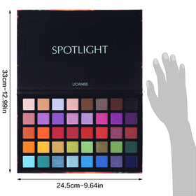UCANBE eyeshadow palette in lifestyle setting with makeup brushes