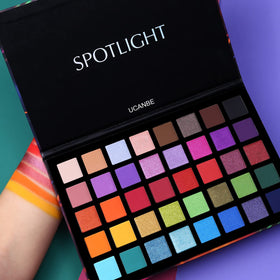 UCANBE eyeshadow palette open displaying vibrant shades