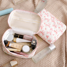 uekeboag Quilted Makeup Bags displayed in a travel setting