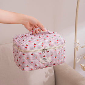ukeboag Large Travel Quilted Makeup Bag displayed with cosmetics