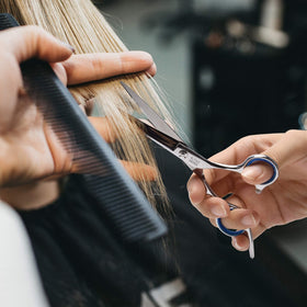 ULG hair scissors and thinning shears on a wooden table