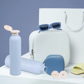 UMETASS blue travel bottle with toiletries