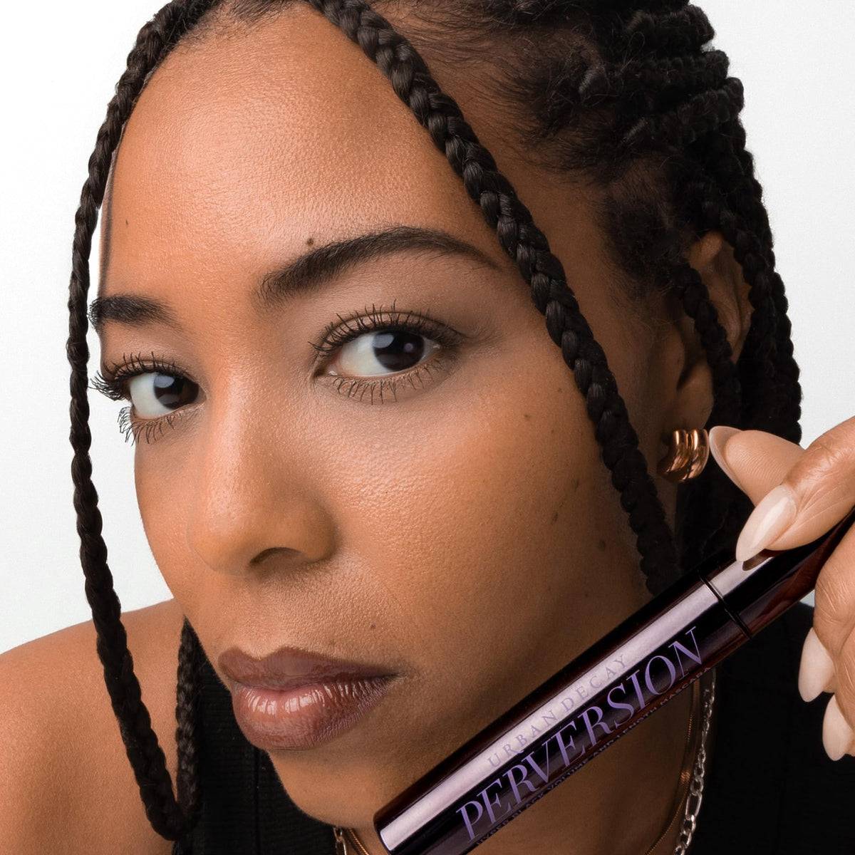 URBAN DECAY Perversion Mascara in lifestyle setting with other makeup products
