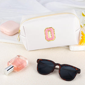 URSKYTOUS Initial Makeup Bag on a vanity with beauty tools
