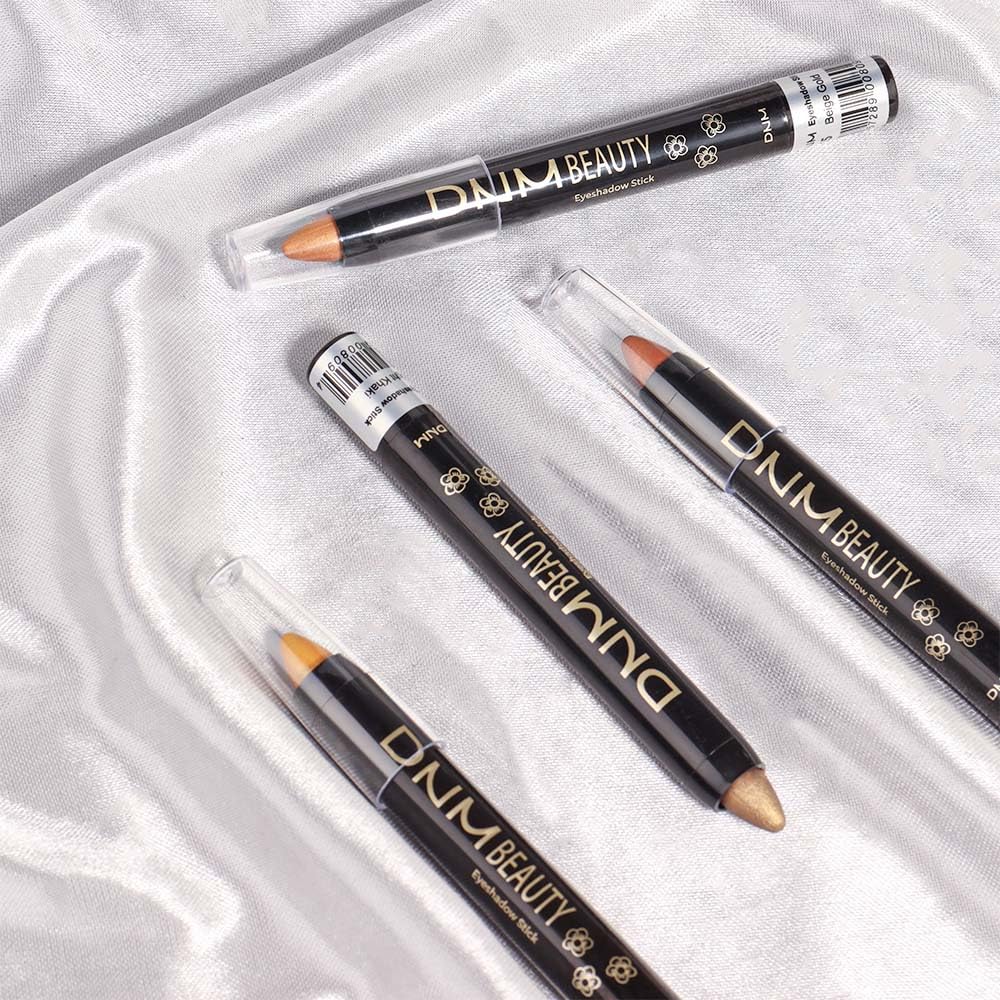 User applying evpct Shimmer Cream Eye Shadow Stick outdoors