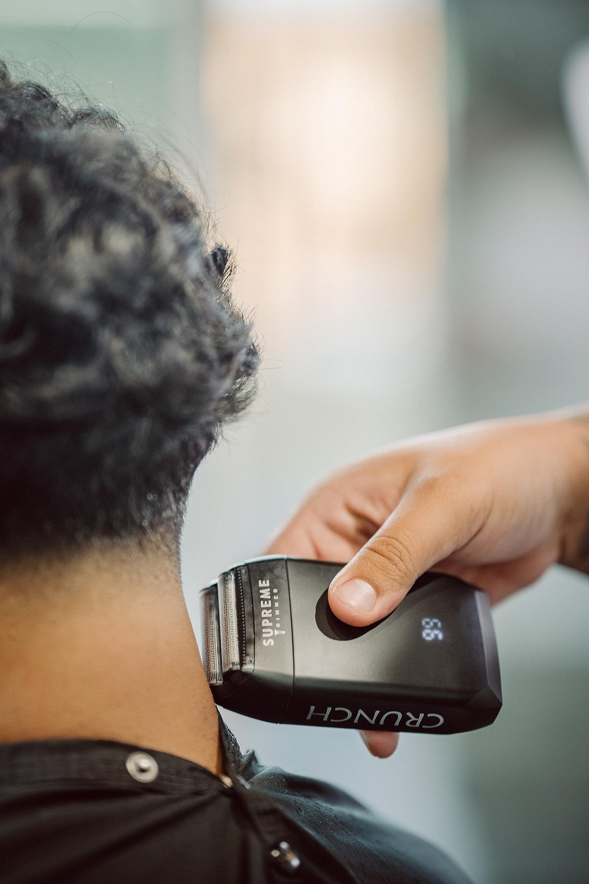 User demonstrating the T-Shaper Trimmer