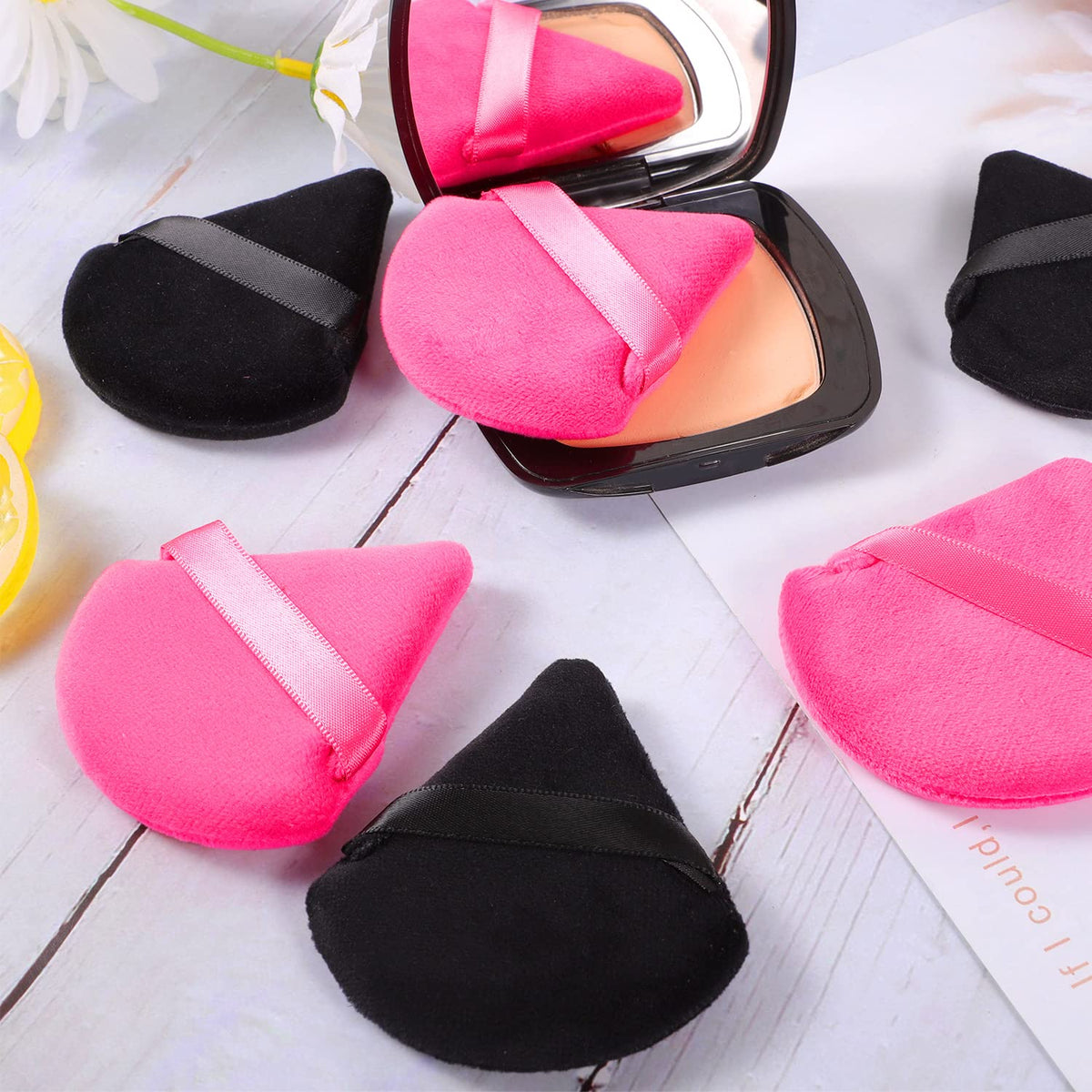 User holding Pimoys powder puff for makeup application