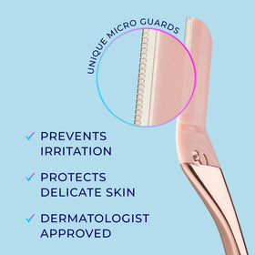 User holding Schick Hydro Silk Dermaplaning Wand in bathroom