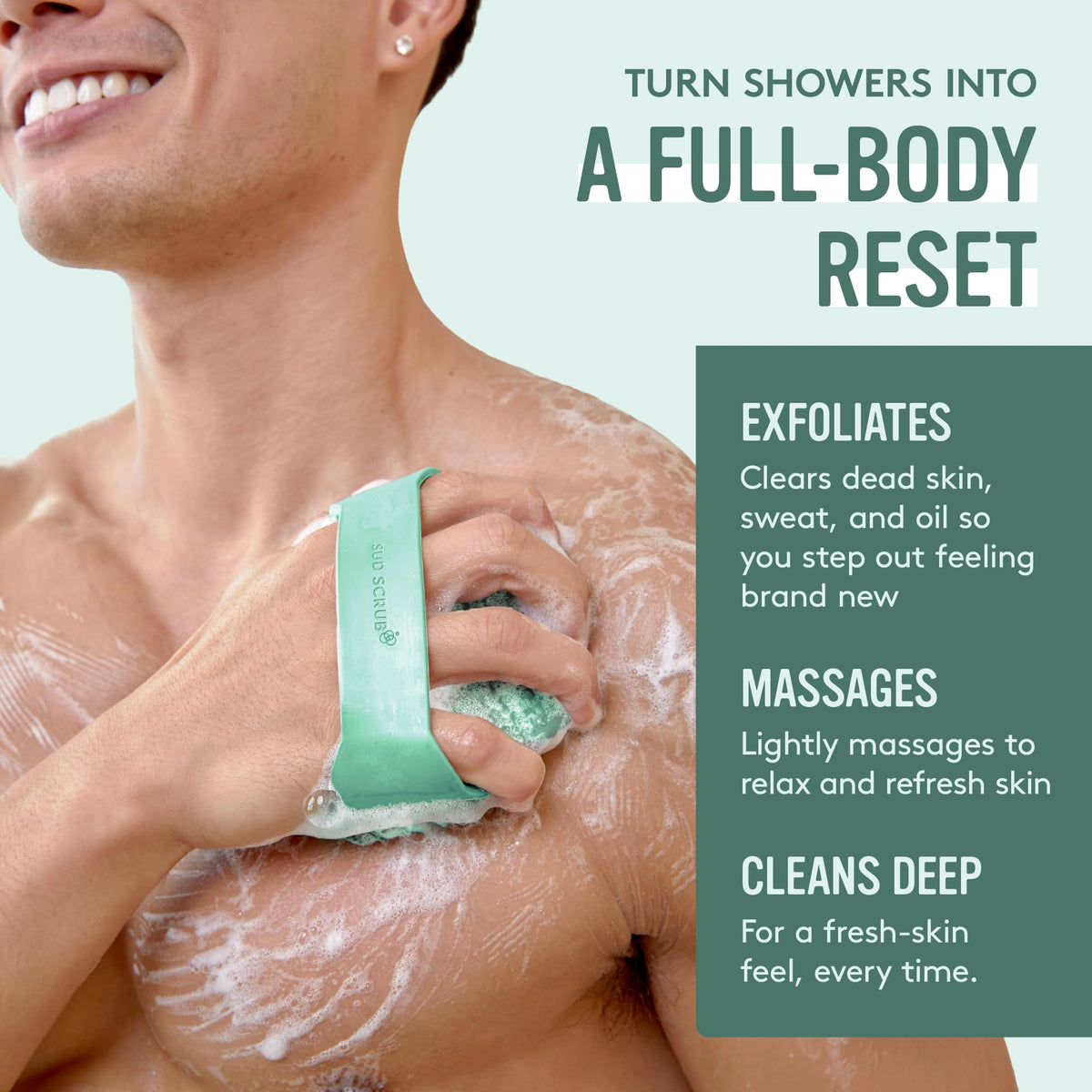 User holding Sud Scrub Antimicrobial Silicone Body Scrubber in shower