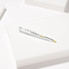 User holding Tweezerman Slant Tweezer for eyebrow grooming